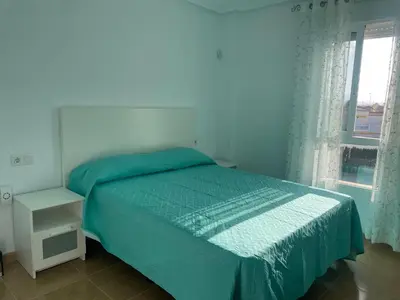 Cama o camas de una habitación en APARTAMENTO NUDISTA BAHIA De VERA