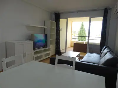 Una televisión o centro de entretenimiento en APARTAMENTO NUDISTA BAHIA De VERA