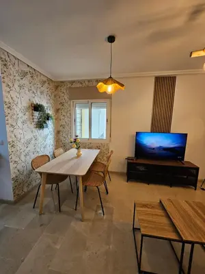 Una televisión o centro de entretenimiento en Apartamento Alma de Garrucha