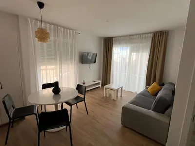 Una televisión o centro de entretenimiento en Apartamento San Antonio 1