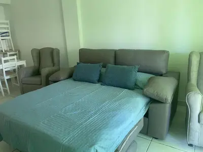 Cama o camas de una habitación en APARTAMENTO BAJO TERRAZA URBANIZACION ACCESO DiRECTO PLAYA
