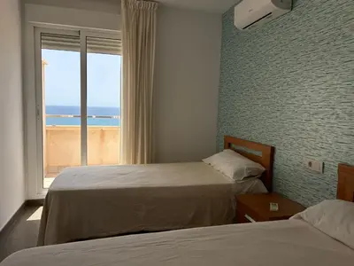 Cama o camas de una habitación en Candela 53 Dúplex con terraza y piscina