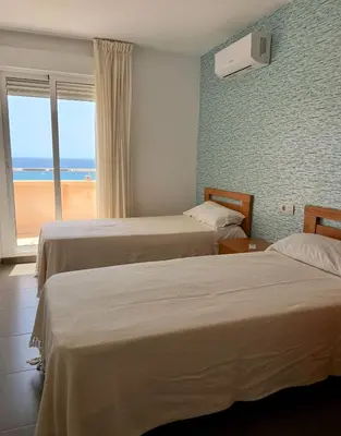 Cama o camas de una habitación en Candela 57 Dúplex con terraza y piscina