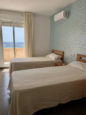 Cama o camas de una habitación en Candela 57 Dúplex con terraza y piscina