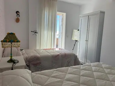 Cama o camas de una habitación en Candela Atico con piscina compartida