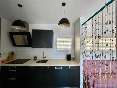 Una cocina o zona de cocina en Candela Atico con piscina compartida