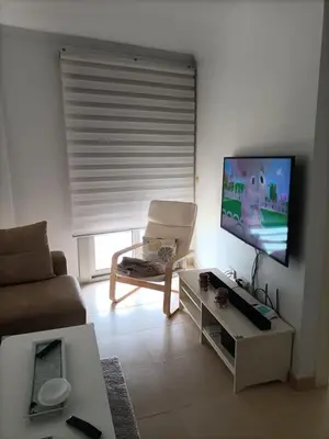 Una televisión o centro de entretenimiento en Apartamento Hornillo