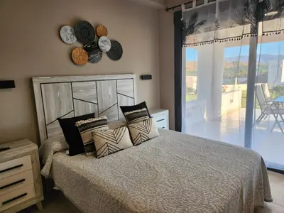 Cama o camas de una habitación en Bajo con vistas a la piscina en Valle del Este Golf