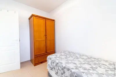 Cama o camas de una habitación en Cómodo apartamento en El Calón Playa frente al mar