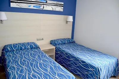Cama o camas de una habitación en Best Club Vacaciones Pueblo Indalo