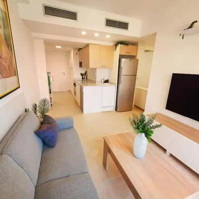 Una televisión o centro de entretenimiento en Apartamento Vera Playa - Almería