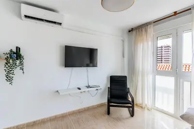 Una televisión o centro de entretenimiento en Apartamento Paquita R&R