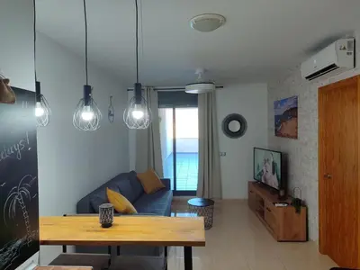 Una televisión o centro de entretenimiento en La Envía Golf and Relax