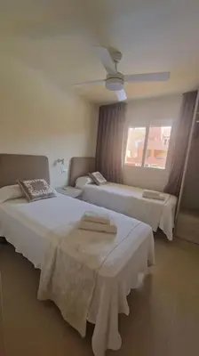 Cama o camas de una habitación en Apartamento junto al mar