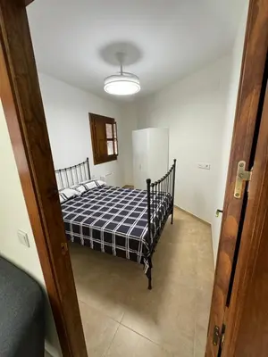 Cama o camas de una habitación en Apartamentos Peñaflor