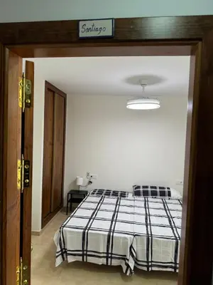 Cama o camas de una habitación en Apartamentos Peñaflor