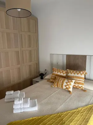 Cama o camas de una habitación en Apartamentos El Llano Dorado 15