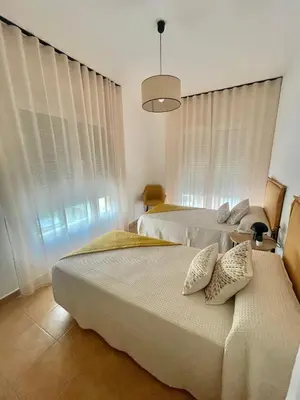Cama o camas de una habitación en Apartamentos El Llano Dorado 15