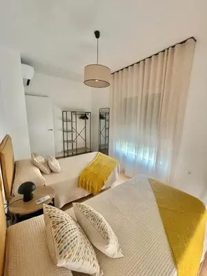 Cama o camas de una habitación en Apartamentos El Llano Dorado 15