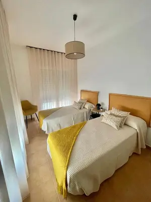Cama o camas de una habitación en Apartamentos El Llano Dorado 15