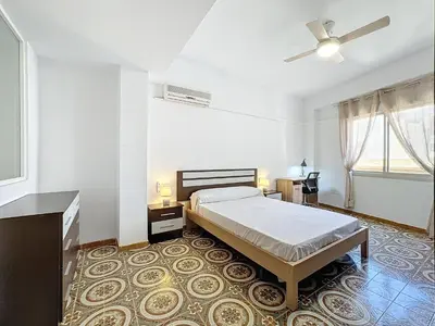 Cama o camas de una habitación en Apartamento 4 dormitorios Parking incluido.