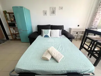 Cama o camas de una habitación en Luminoso ático en el Puerto de Almerimar