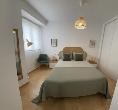 Cama o camas de una habitación en Apartamento con piscina frente al mar en Mojácar playa para familias y parejas de más de 30 años