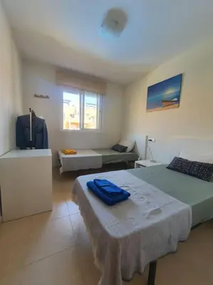 Cama o camas de una habitación en Paraíso Vera Playa
