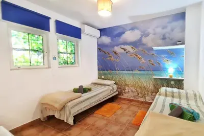 Cama o camas de una habitación en Kokomo on the beach with heated swimming pool