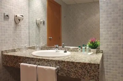 Un baño de Advise Hotels Reina