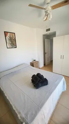 Cama o camas de una habitación en Apartamento dos habitaciones con piscina y gran terraza