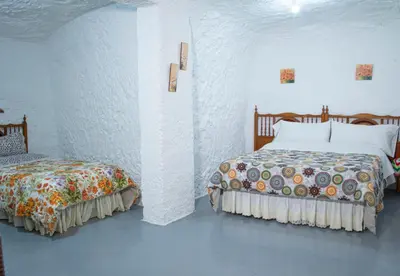 Cama o camas de una habitación en Cueva Navarro