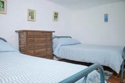 Cama o camas de una habitación en Cueva Navarro