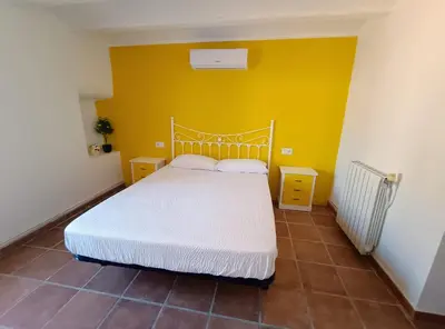 Cama o camas de una habitación en El Oasis Morado
