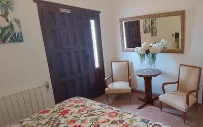Cama o camas de una habitación en El Oasis Morado