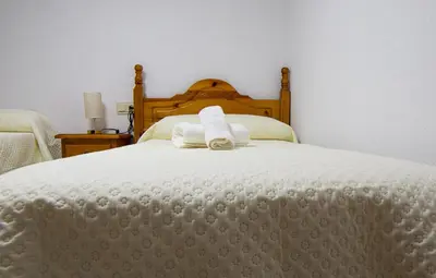 Cama o camas de una habitación en 5 Apartamentos Cómodos en el Corazón de Baza