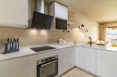 Una cocina o zona de cocina en Vera Golf Los Dos Soles Bajo Jardín Piscina Wifi