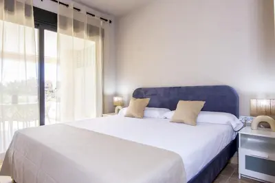 Cama o camas de una habitación en Vera Golf Los Dos Soles Bajo Jardín Piscina Wifi