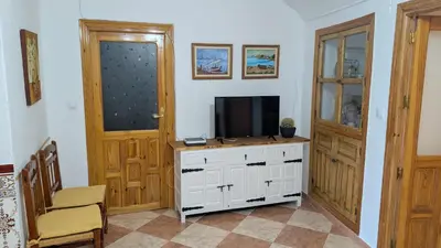 Una televisión o centro de entretenimiento en Cueva Rincón Bustamante