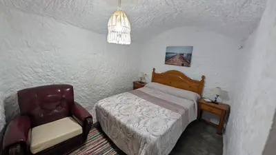 Cama o camas de una habitación en Cueva Rincón Bustamante