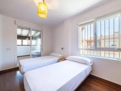 Cama o camas de una habitación en Apartment Ático Playa Zapillo by Interhome