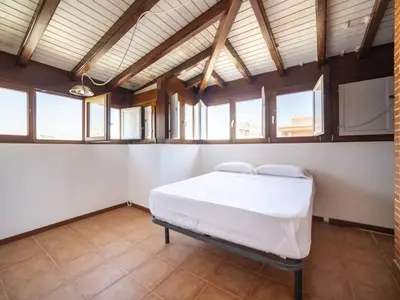Cama o camas de una habitación en Apartment Ático Playa Zapillo by Interhome