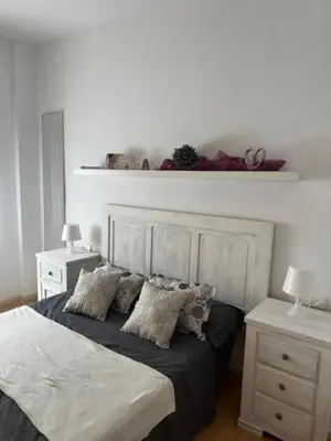 Cama o camas de una habitación en Piso Caramel
