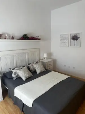 Cama o camas de una habitación en Piso Caramel