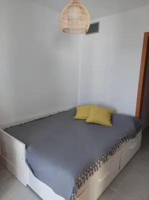 Cama o camas de una habitación en Increíbles vistas a pie de playa