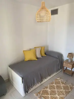 Cama o camas de una habitación en Increíbles vistas a pie de playa