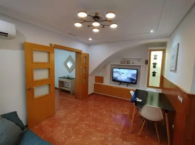 Una televisión o centro de entretenimiento en Casa planta baja en Gador