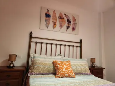 Cama o camas de una habitación en Casa Baja tranquila con terraza y jardín en Vera-Playa naturista!
