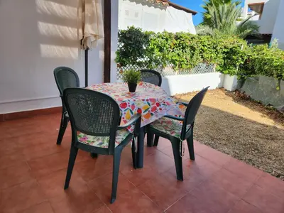 Zona de estar de Casa Baja tranquila con terraza y jardín en Vera-Playa naturista!