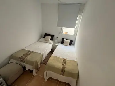 Cama o camas de una habitación en Ático en primera línea de playa